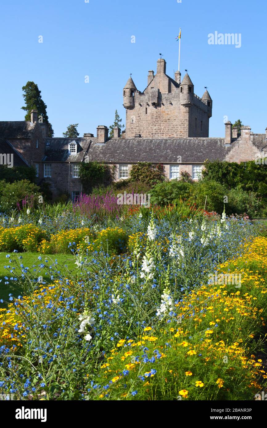 One of four gardens, the aptly-named Flower Garden bathes Cawdor Castle's 15th century tower house in brilliant color.  Owned and inhabited by the sam Stock Photo