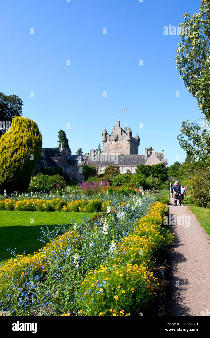 One of four gardens, the aptly-named Flower Garden bathes Cawdor Castle's 15th century tower house in brilliant color.  Thane family seat. Stock Photo