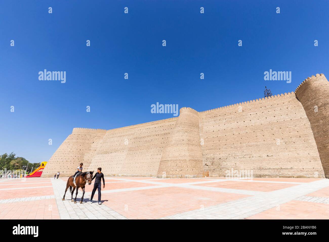 Children horse riding, at The Ark fortress, Bukhara, Buchara, Uzbekistan, Central Asia, Asia Stock Photo