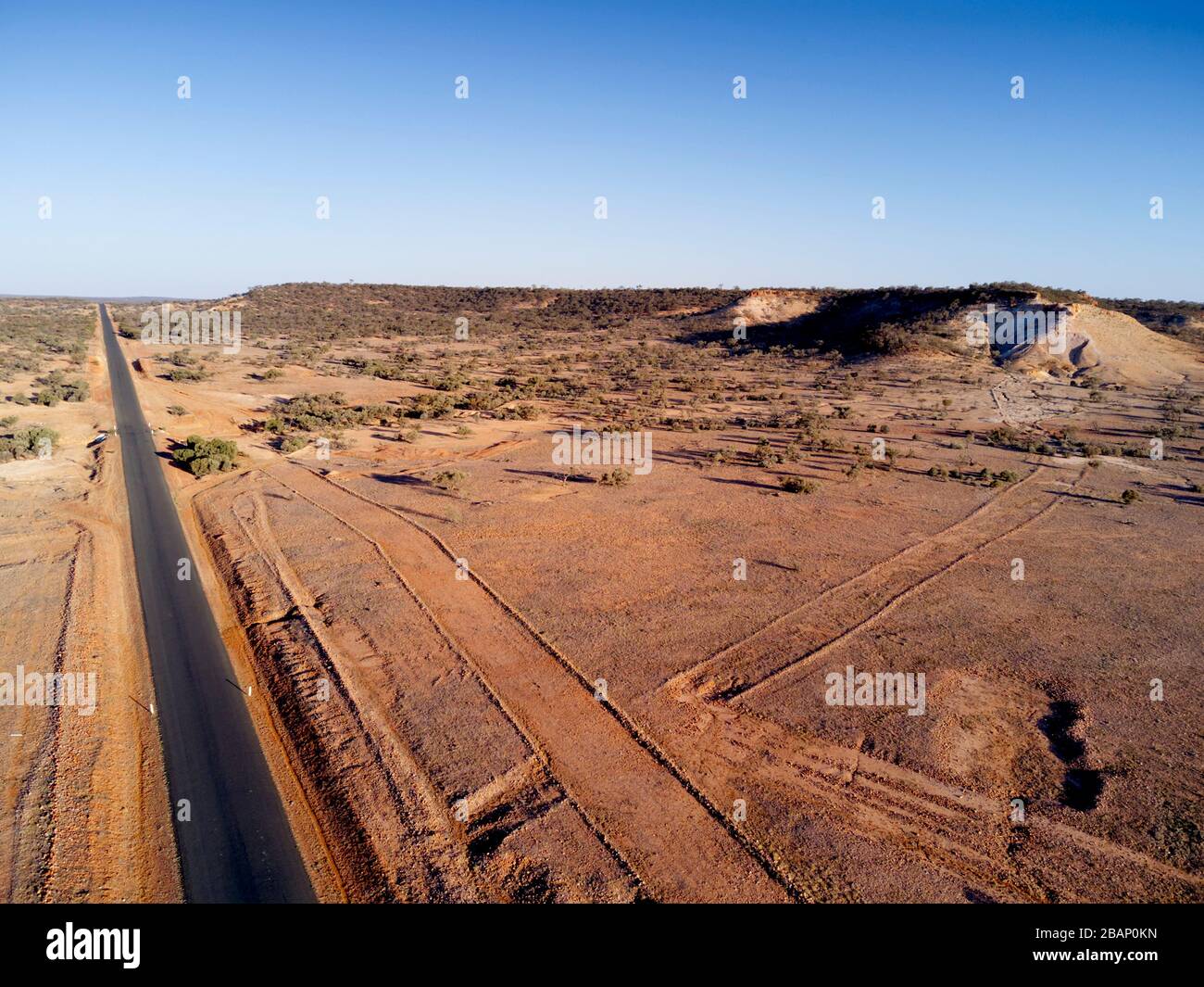 Aerial of the Adventure Way highway as it passes hilly country near