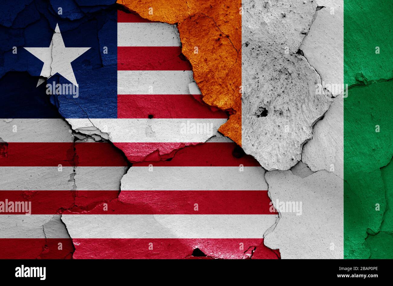 flags of Liberia and Ivory Coast painted on cracked wall Stock Photo ...