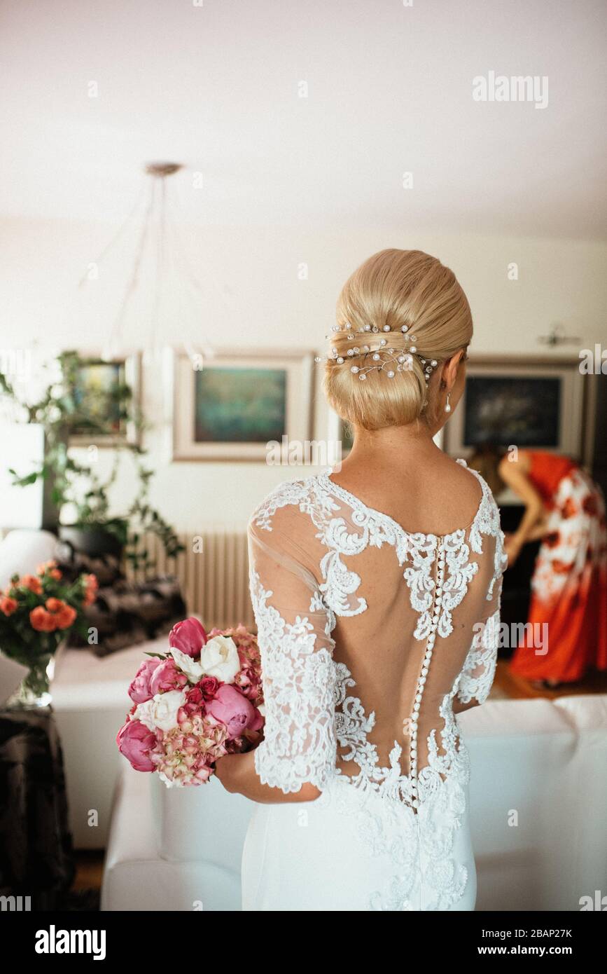The bride in a beautiful wedding dress and her bridal bouquet of ...