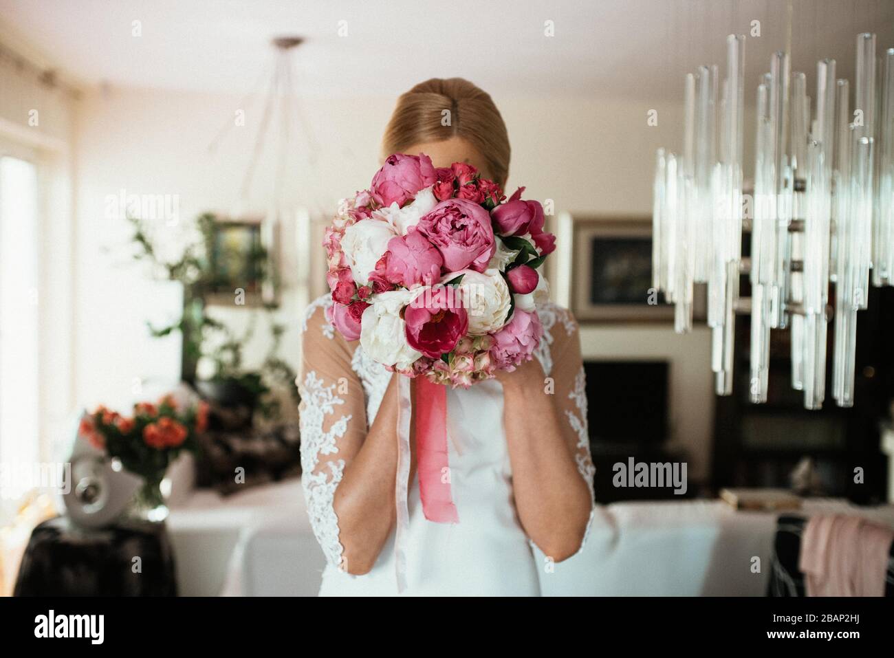 The bride in a beautiful wedding dress and her bridal bouquet of ...