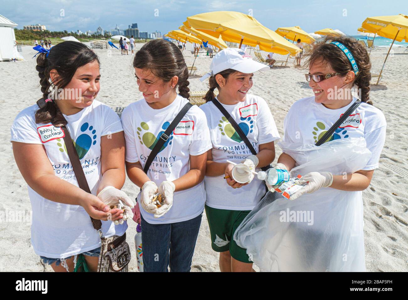 Miami Beach Florida,Hands On HandsOn,Miami Beach,Clean up,litter,trash,pollution,sand,volunteer volunteers volunteering work worker workers,working to Stock Photo