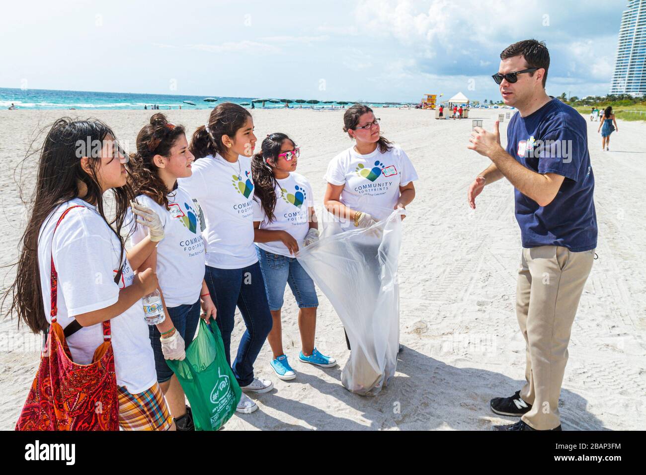 Miami Beach Florida,Hands On HandsOn,Miami Beach,Clean up,litter,trash,pollution,sand,volunteer volunteers volunteering work worker workers,working to Stock Photo