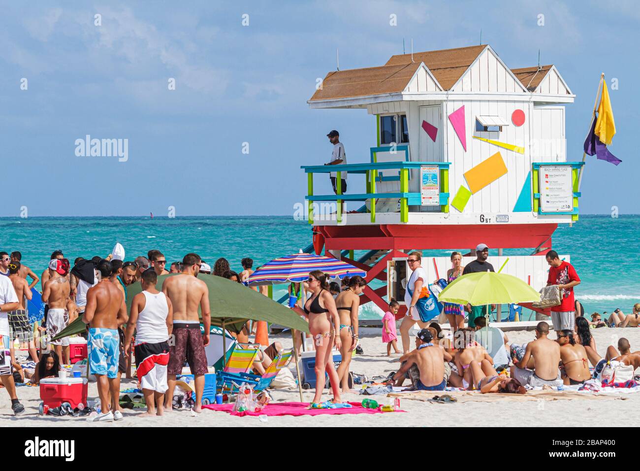 Miami Beach Florida,Atlantic Ocean,water,sunbathers,weekend,crowded,packed,Spring Break,student students lifeguard station,FL110429041 Stock Photo