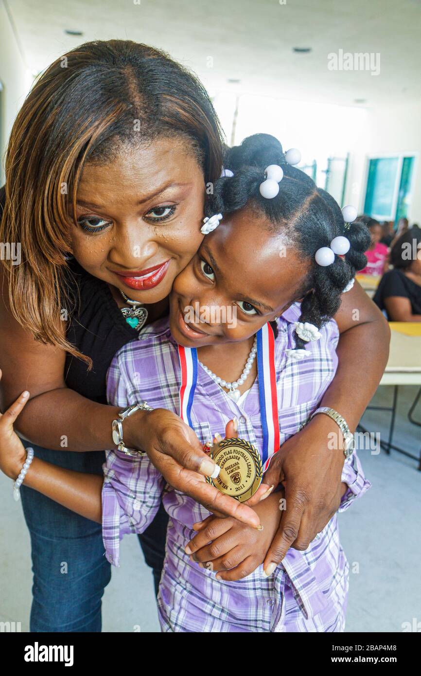 North Miami Beach Florida,Police Station,Neighborhood Football League Awards Ceremony,medal,medallion,Black Blacks African Africans ethnic minority,gi Stock Photo