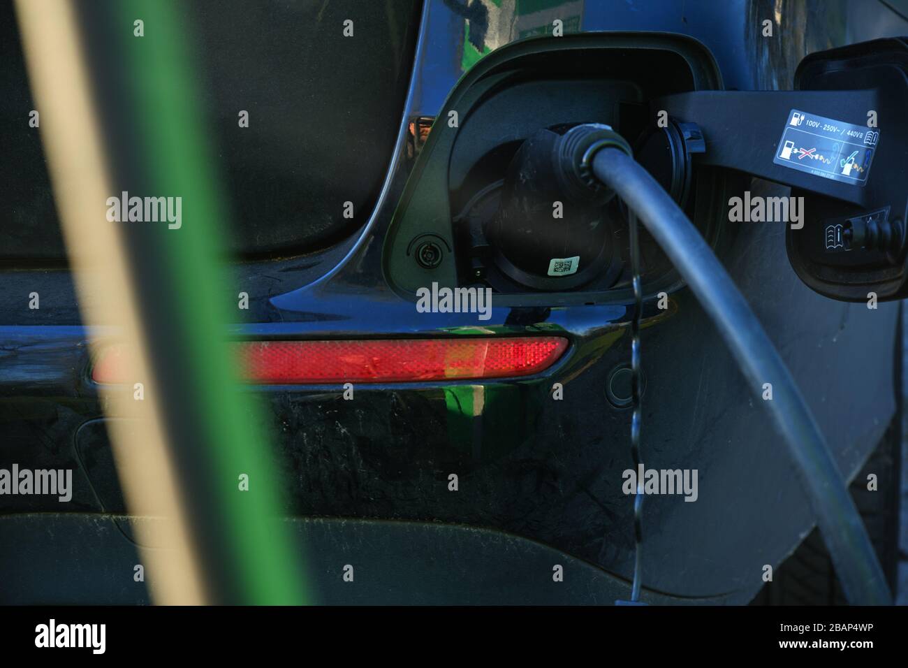 Electrical car charging battery while parking Stock Photo Alamy