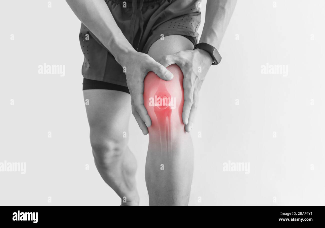 Joint pain, Arthritis and tendon problems. a man touching nee at pain point, on white background Stock Photo