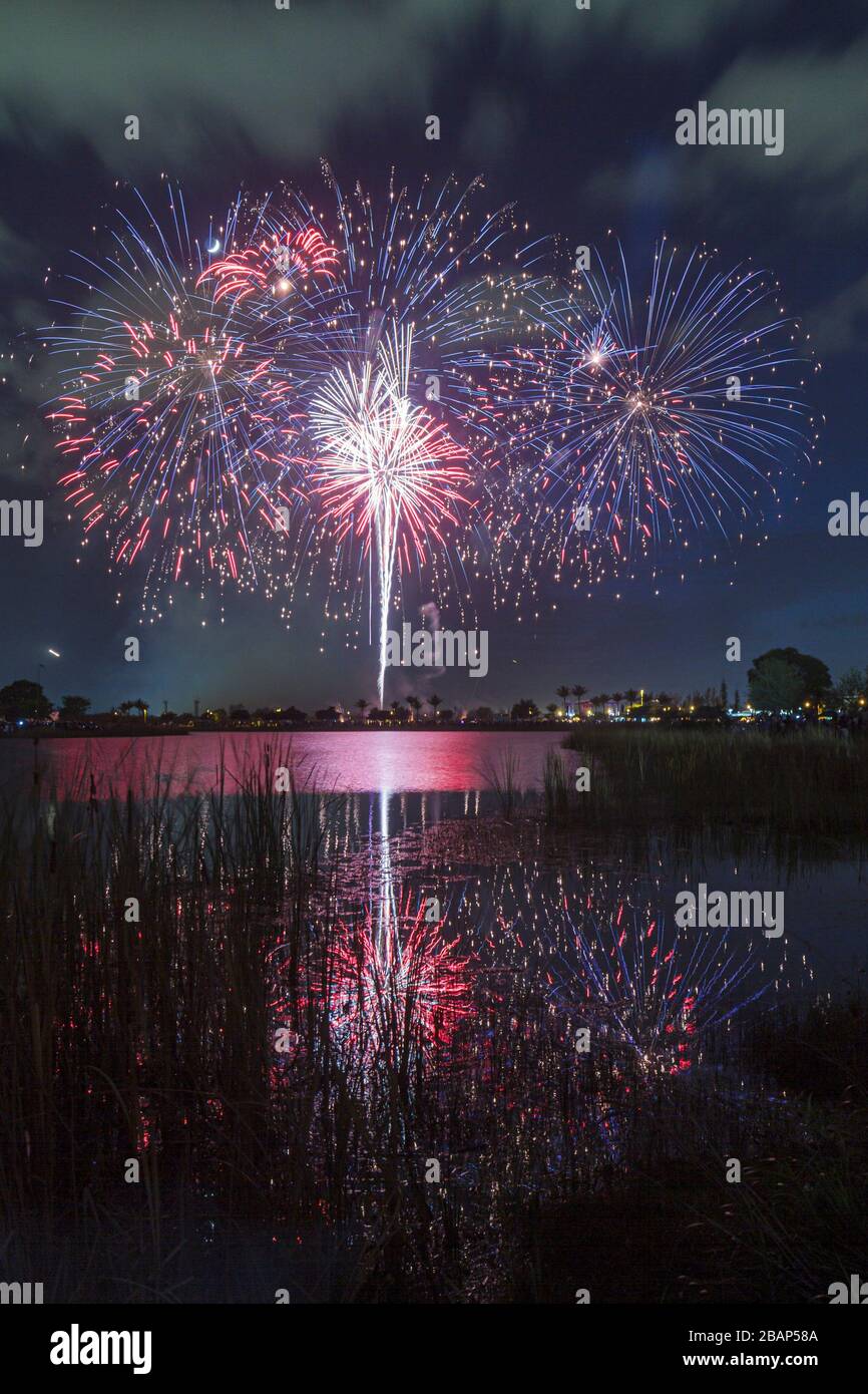 Miami Florida,Doral,J. C. Bermudez Park,Fourth 4th of July tradition,fireworks,burst,water,reflection,FL110704030 Stock Photo
