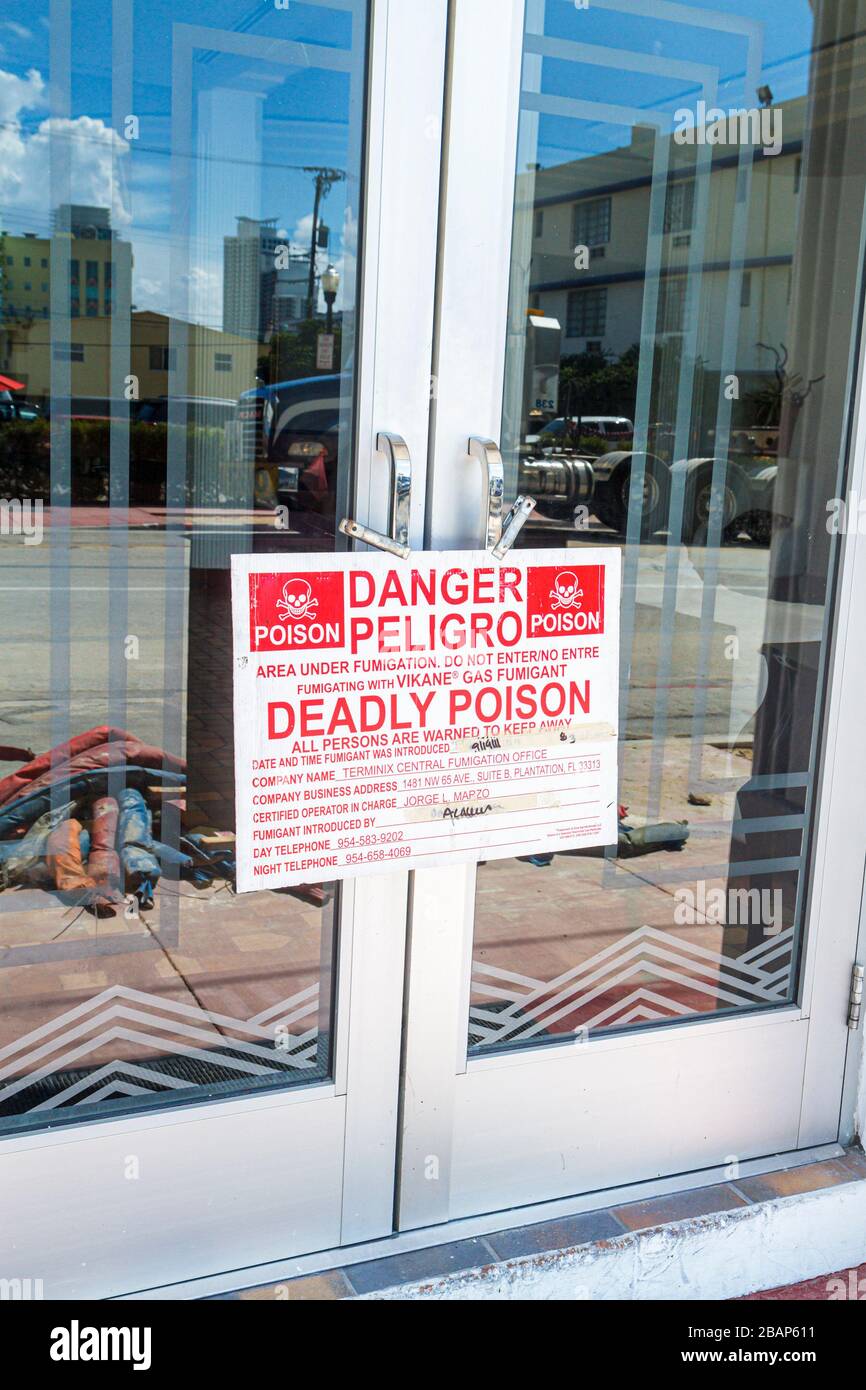Miami Beach Florida,Ocean Drive,Savoy,hotel,sign,deadly poison,warning,Spanish language,bilingual,bilingual,fumigation,Vikane gas fumigant,FL111014001 Stock Photo