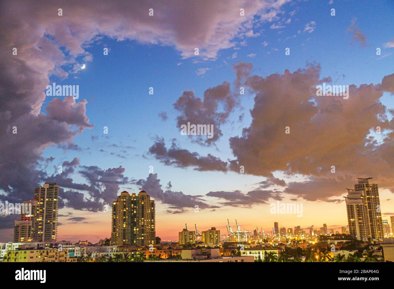 Miami Beach Florida,dusk,evening,moon,clouds,sky,high rise,condominiums,city skyline,FL111014046 Stock Photo