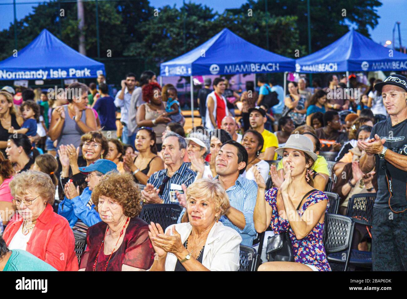 Miami Beach Florida,North Beach,Northshore Park,Hispanic Heritage Festival,audience,clapping,man men male adult adults,woman female women,senior senio Stock Photo
