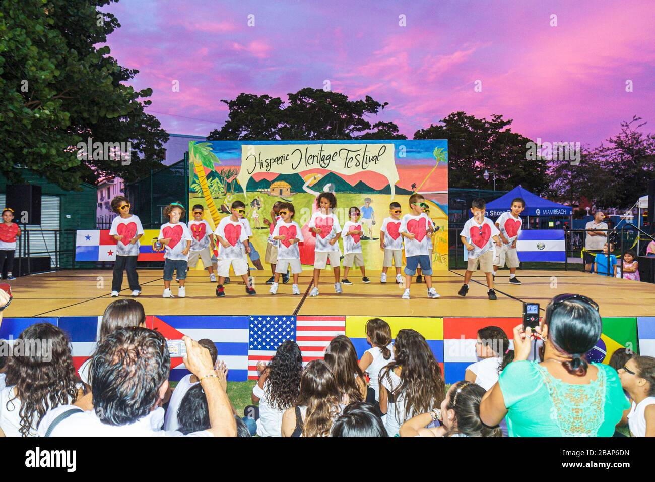 Miami Beach Florida,Hispanic Heritage Festival,stage dancing boys kids children 1st first graders,Latin American flags audience watching performance Stock Photo