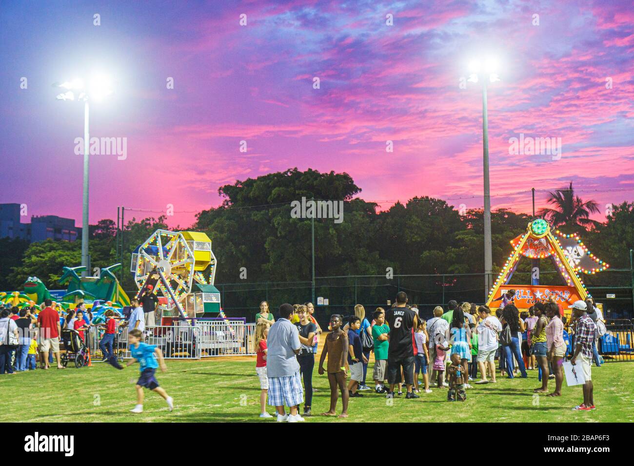 Miami Beach Florida,North Beach,Northshore Park,Hispanic Heritage Festival,carnival rides,sunset,dusk,evening,FL111014190 Stock Photo