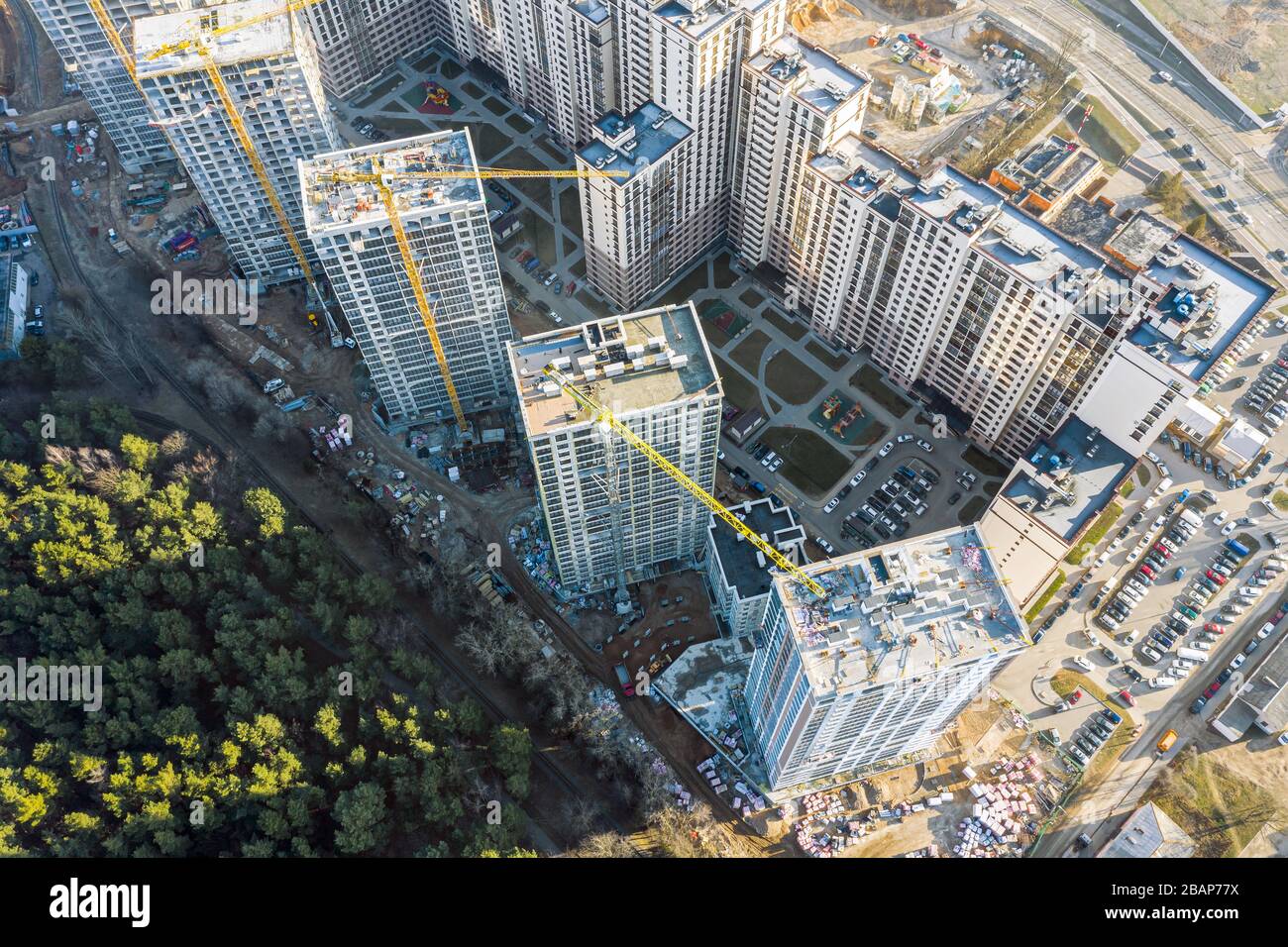 View of construction of new residential area near city park. high-rise ...