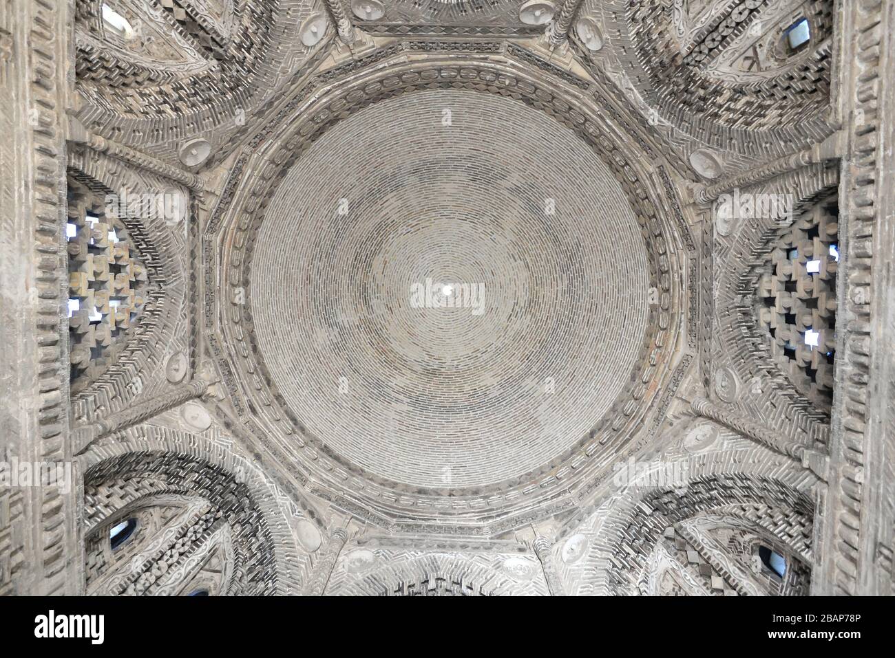 Interior of Samanid Mausoleum in Bukhara, Uzbekistan in Central Asia. Dome of complex brickwork built in octagonal and circular shape. Stock Photo