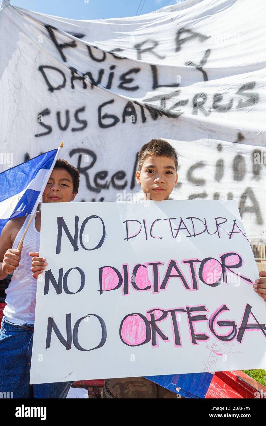 Miami Florida,Flagler Street,near Consulate General of Nicaragua,protest,protesters,signs,demonstration,Spanish language,bilingual,anti Nicaraguan pol Stock Photo