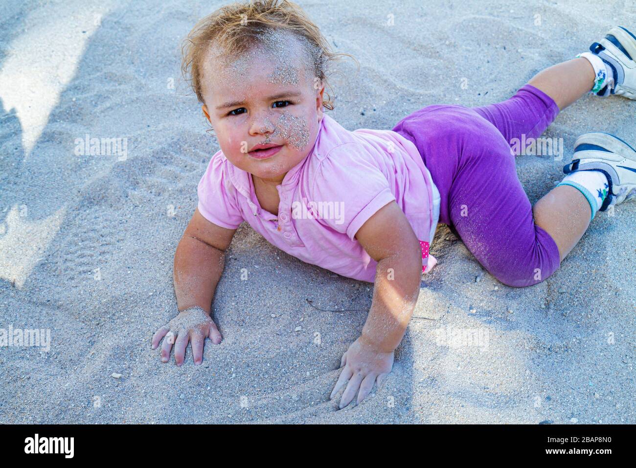 Miami Beach Florida,Lummus Park,baby babies child children,girl girls,youngster youngsters youth youths female kid kids child children,crawling,sand,o Stock Photo
