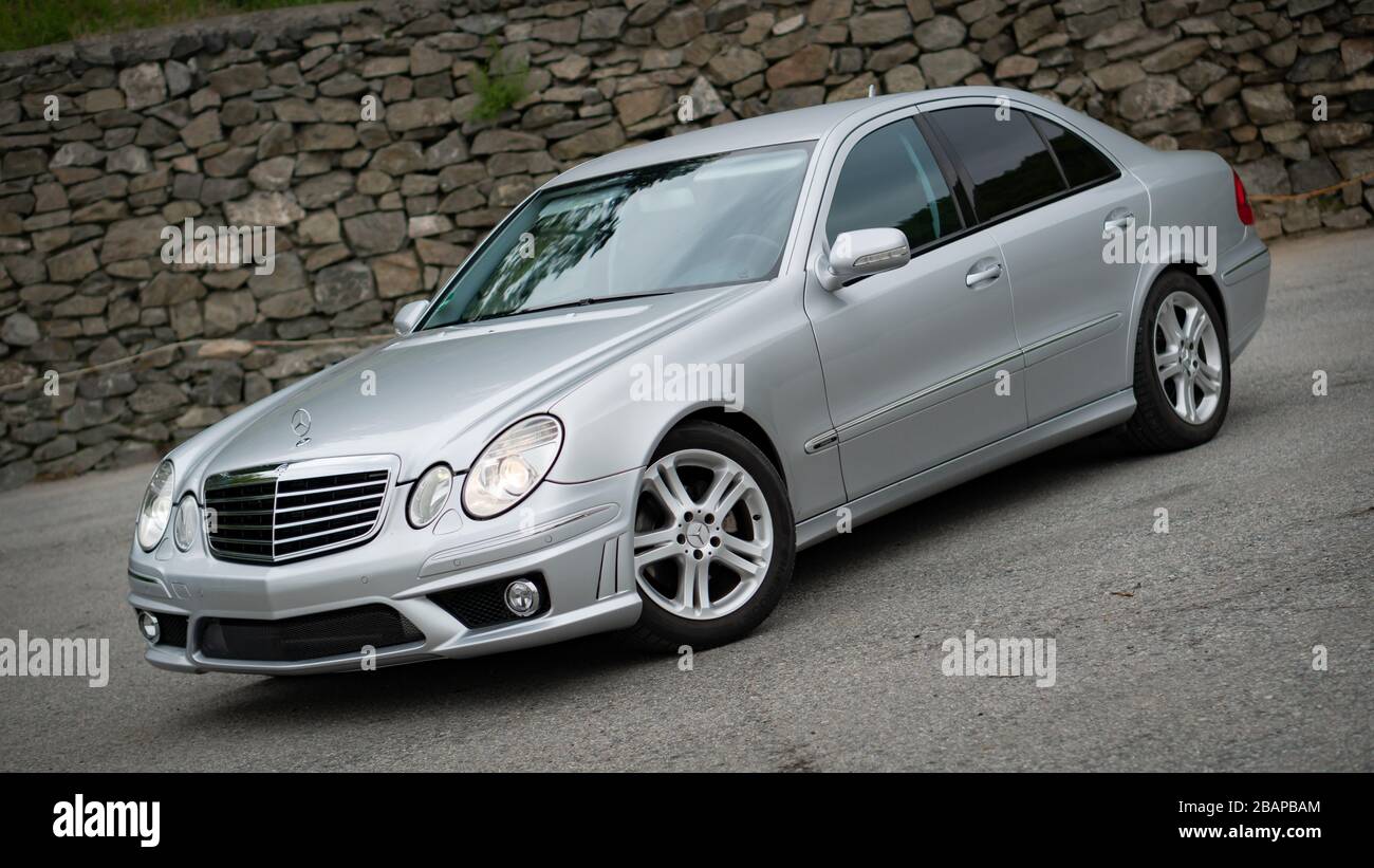 https://c8.alamy.com/comp/2BAPBAM/beautiful-avantgarde-mercedes-benz-w211-year-2008-manual-transmission-winter-rims-isolated-no-people-in-an-empty-parking-lot-2BAPBAM.jpg
