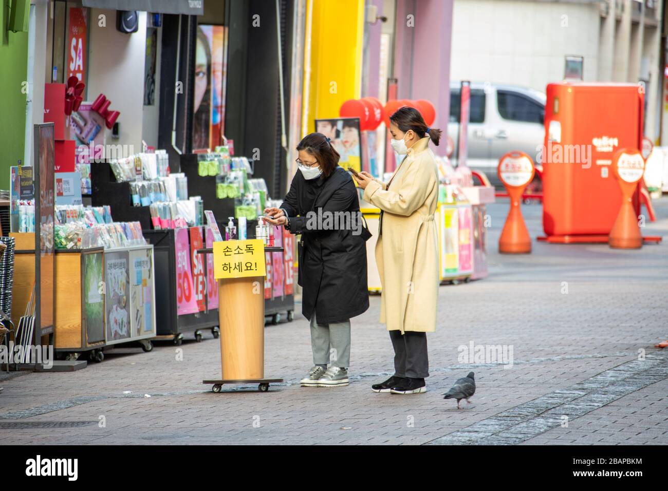 Free hand sanitizer at a cosmetics store, Myongdong market in during the Coronavirus pandemic, Seoul, South Korea Stock Photo