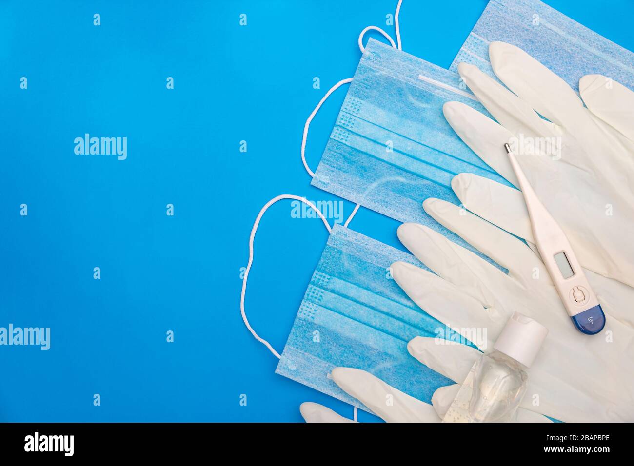 top view image of medical supplies to prevent pandemic infection on classic blue background Stock Photo