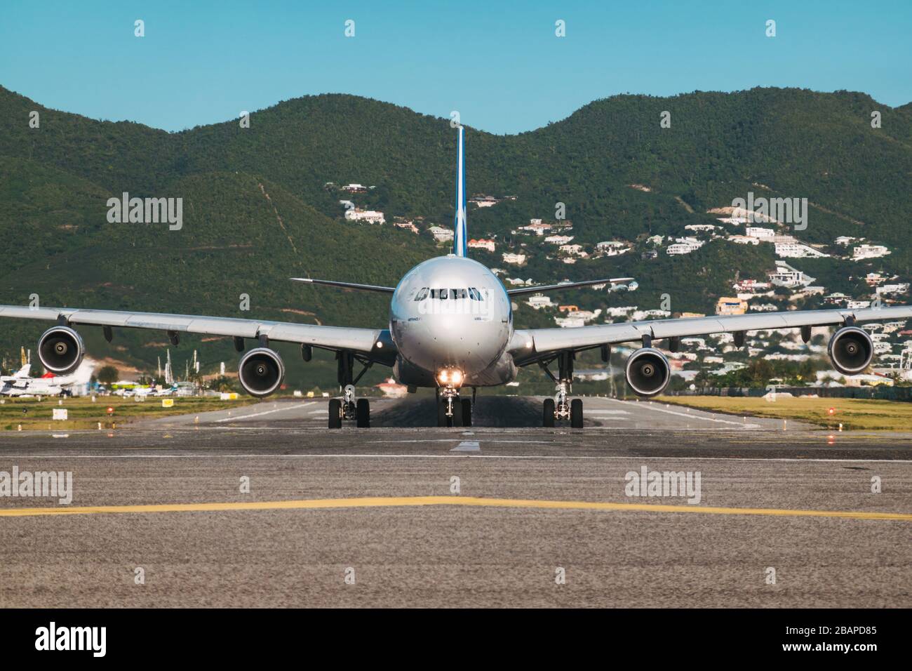 An Airbus A340-300 operated by Air France, in the now-defunct subsidiary Joon's branding. Lining up for takeoff at St. Maarten Stock Photo