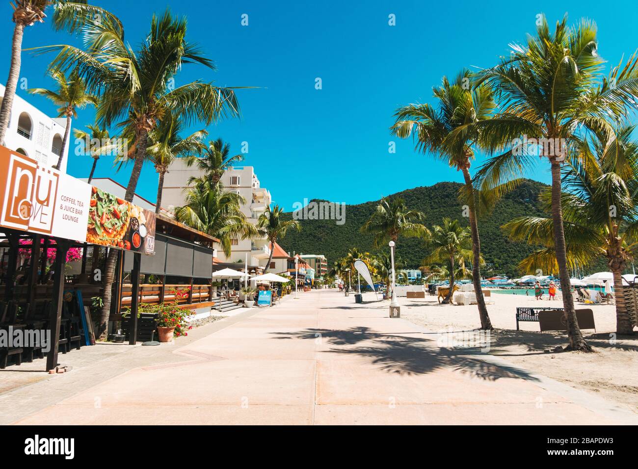 A near-deserted promenade in Philipsburg, St. Maarten. COVID19 created an absence of cruise ship passengers which typically flood the area Stock Photo