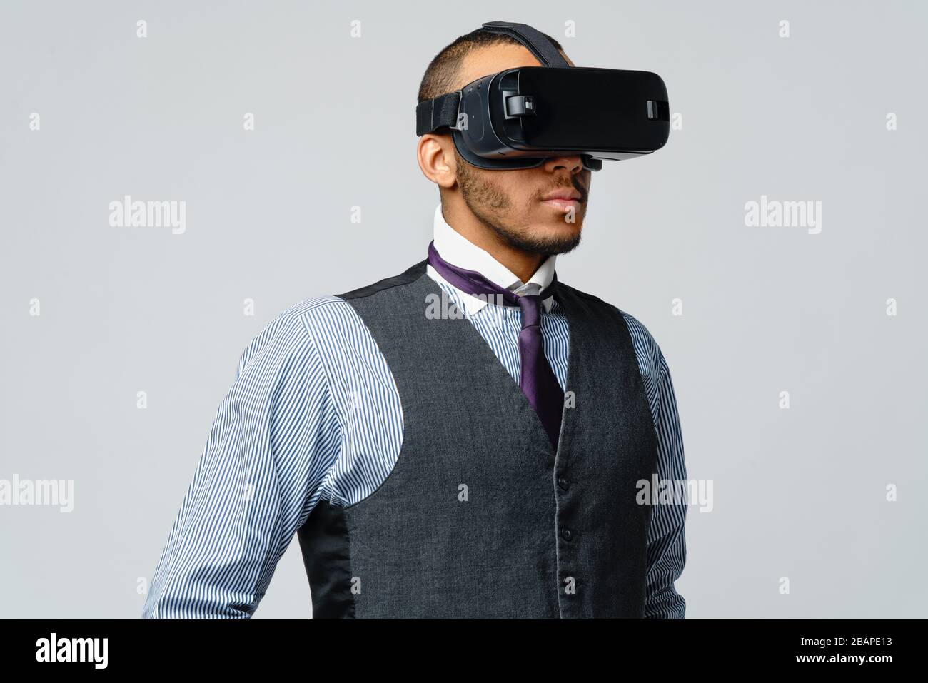 African-american Business man using a virtual reality VR headset Stock Photo