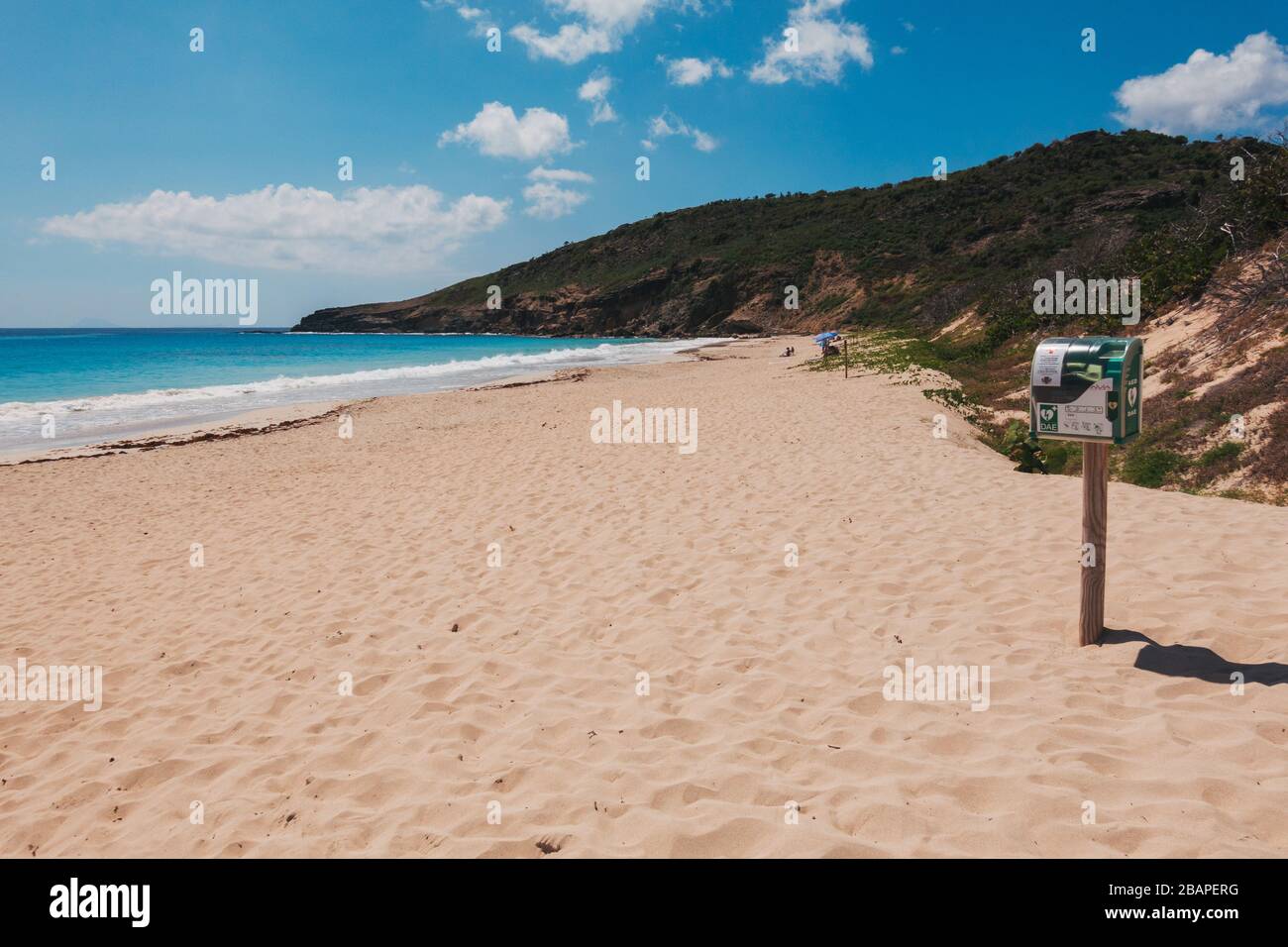 An automated external defibrillator (AED) on a post at Plage de Saline, St Barthélemy, French Caribbean Stock Photo