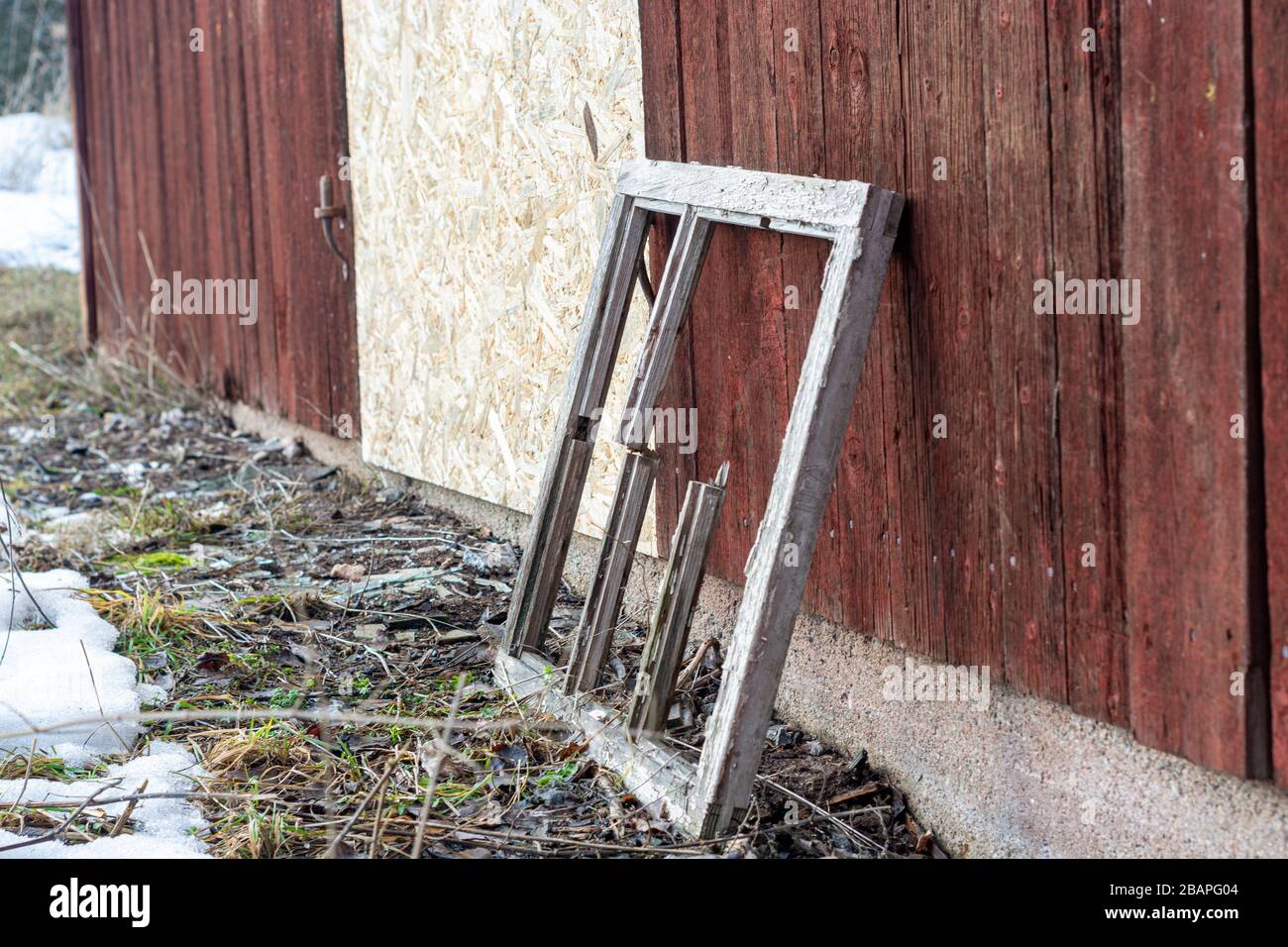 old wooden window frame near a wooden house Stock Photo