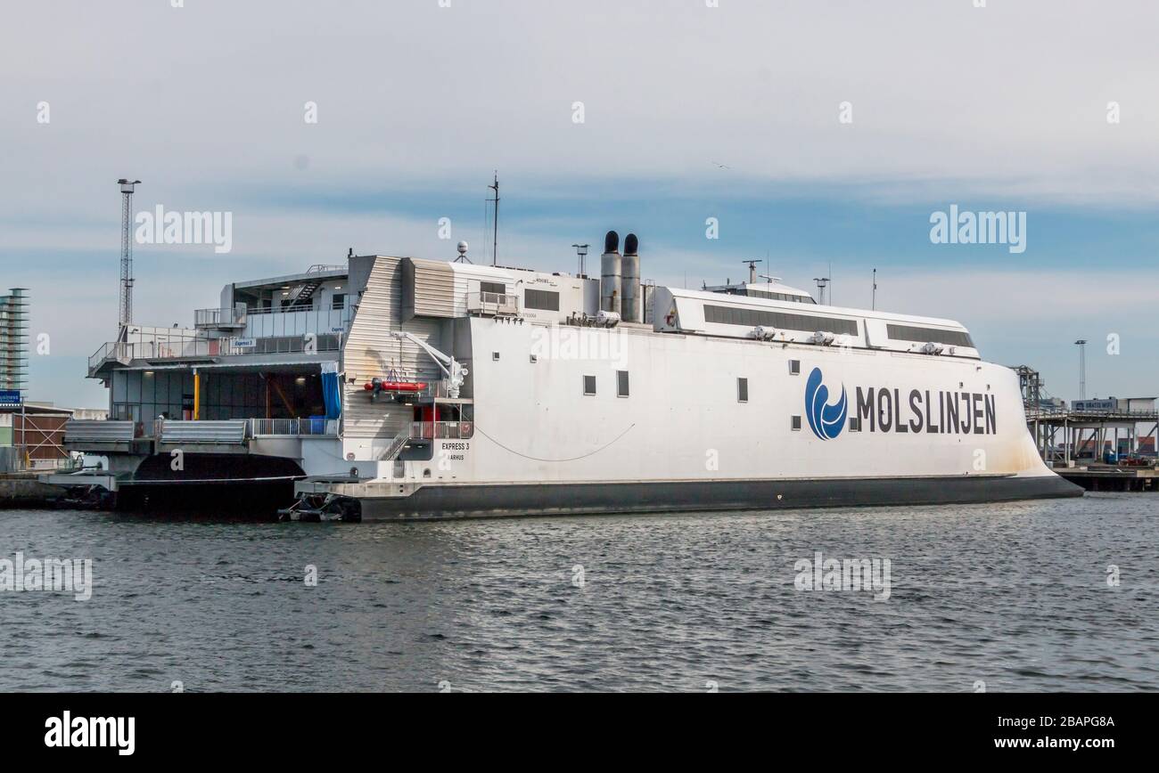 Aarhus, Denmark - 24 march 2020:  The high-speed ferry EXPRESS 3 of the shipping company Molslinjen is moored at the pier in the port of Aarhus Stock Photo