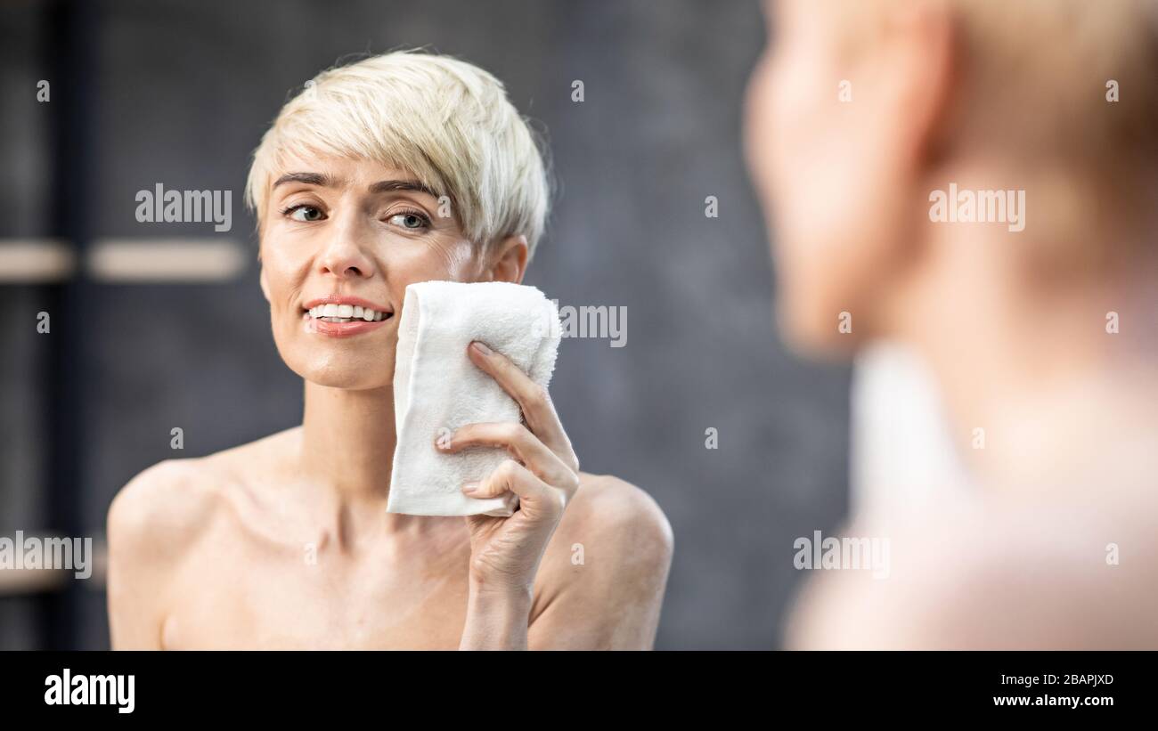 Lady Drying Face Using Towel In Bathroom At Home, Panorama Stock Photo