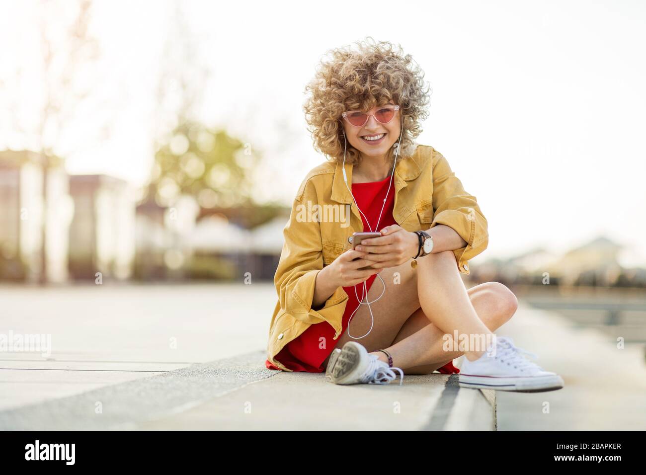 Blond curly hair woman hi-res stock photography and images - Alamy