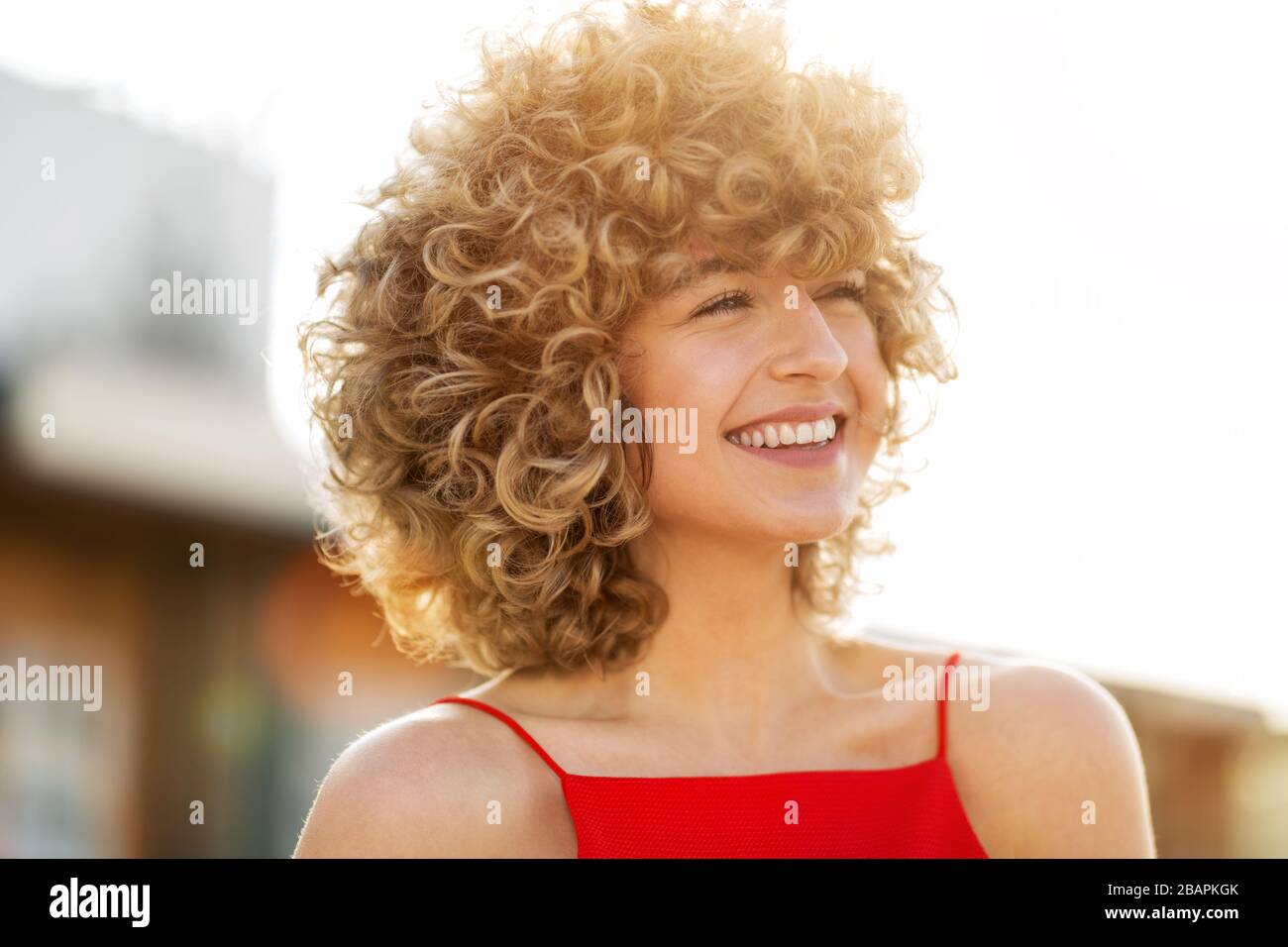 Blond curly hair woman hi-res stock photography and images - Alamy