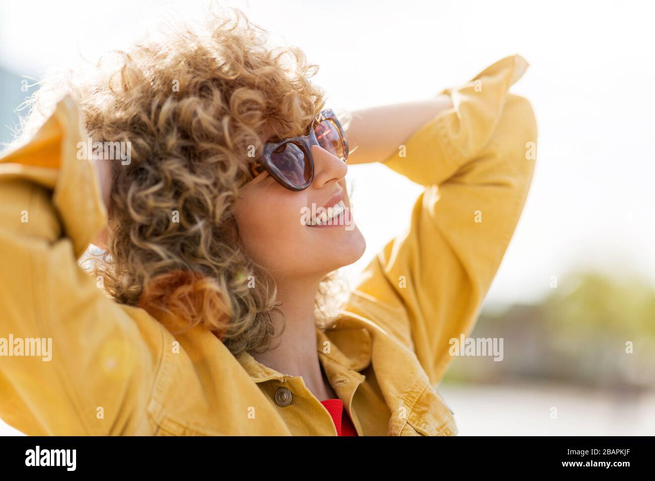 Blond curly hair woman hi-res stock photography and images - Alamy