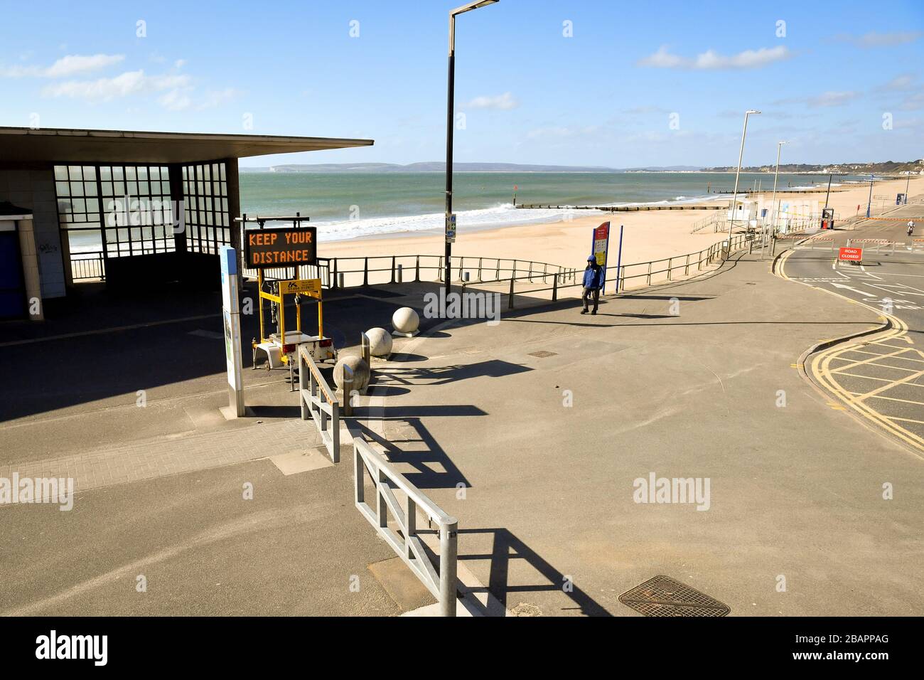 A matrix sign displays Keep Your Distance on Boscombe pier, which is closed, as the UK continues in lockdown to help curb the spread of the coronavirus. Stock Photo