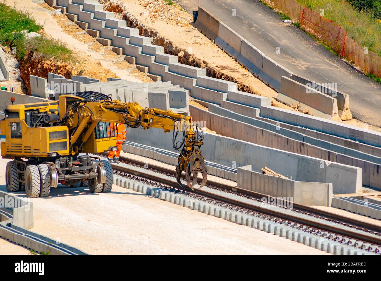 Rail excavator on reconstruction of the railway rails Stock Photo Alamy