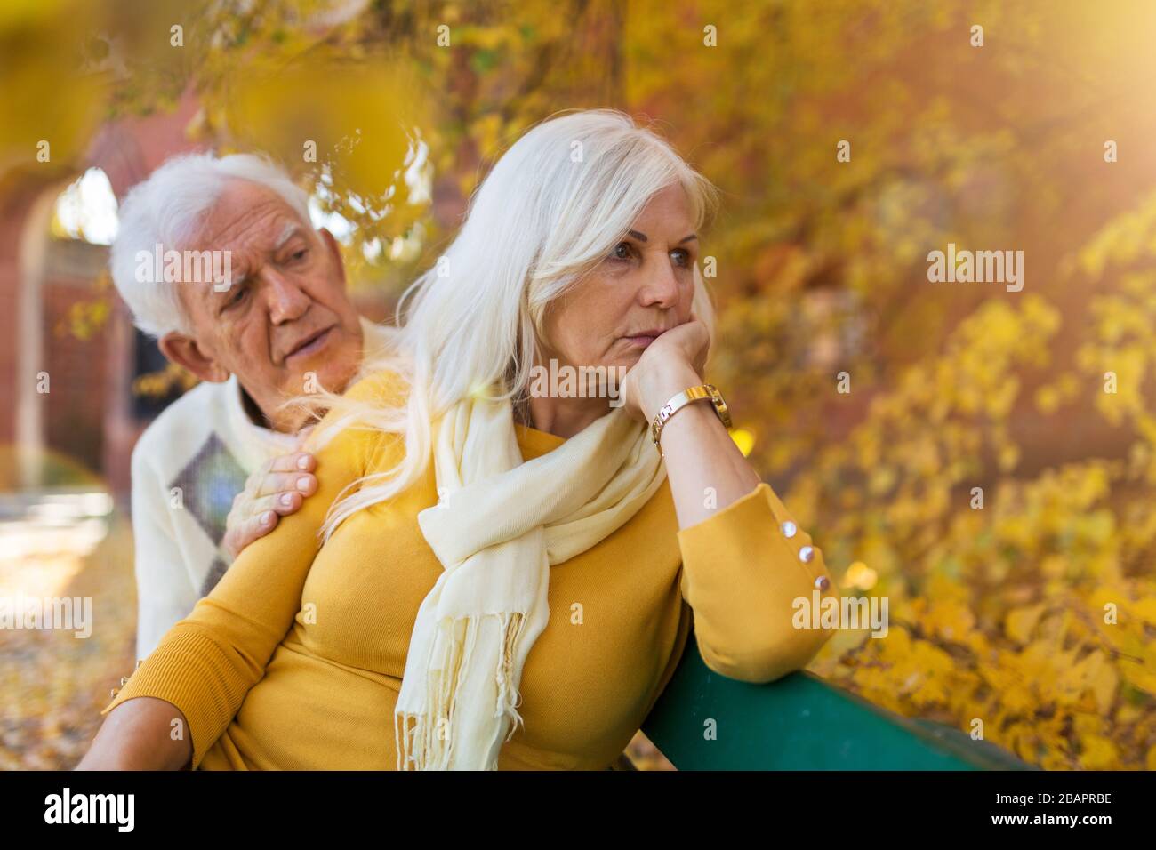 Depressed senior woman consoled by elderly man Stock Photo - Alamy