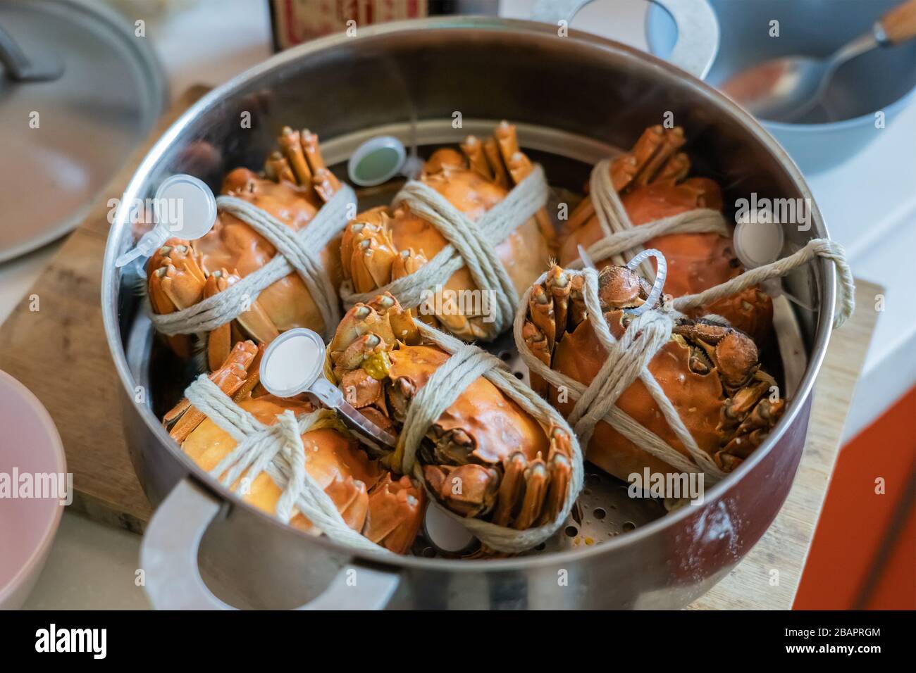 Steamed Hairy Red River Crab. Tied Crab in Steamer Pot Cooked at Home