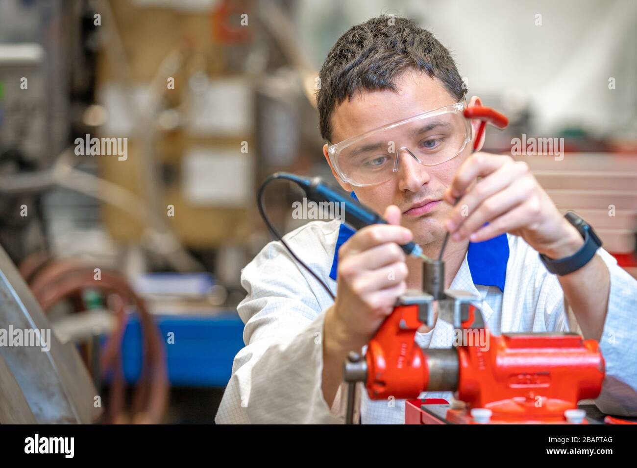 Modern Devic's scientist in the development center makes a part for a new device Stock ...