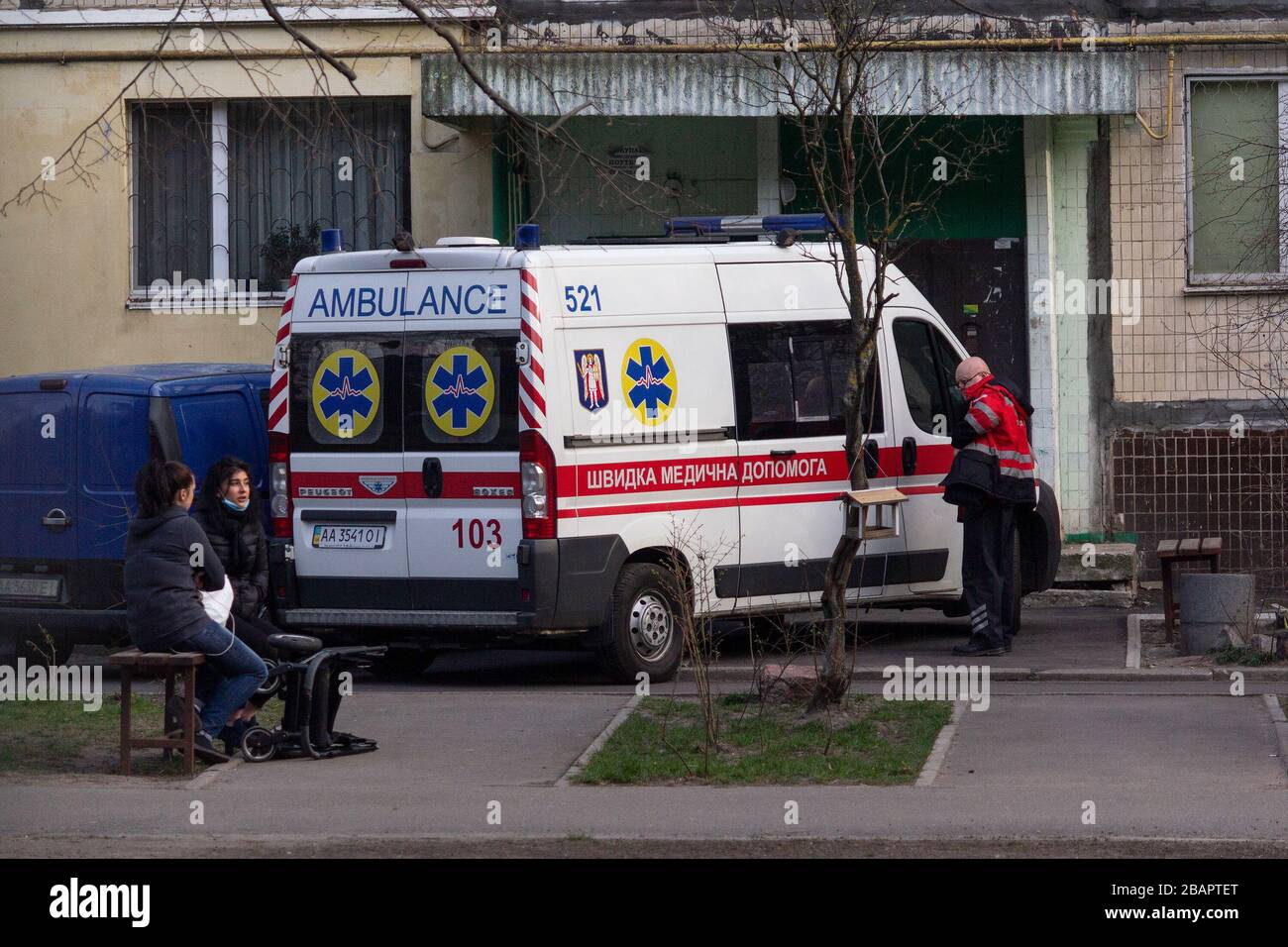 Kiev, Ukraine - March 26, 2020: Ambulance near the entrance of an apartment house Stock Photo