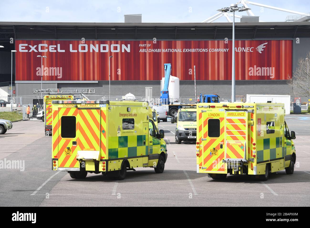 Ambulances at the ExCel centre in London which is being made into a temporary hospital - the NHS Nightingale hospital - comprising of two wards, each of 2,000 people, to help tackle coronavirus. Stock Photo