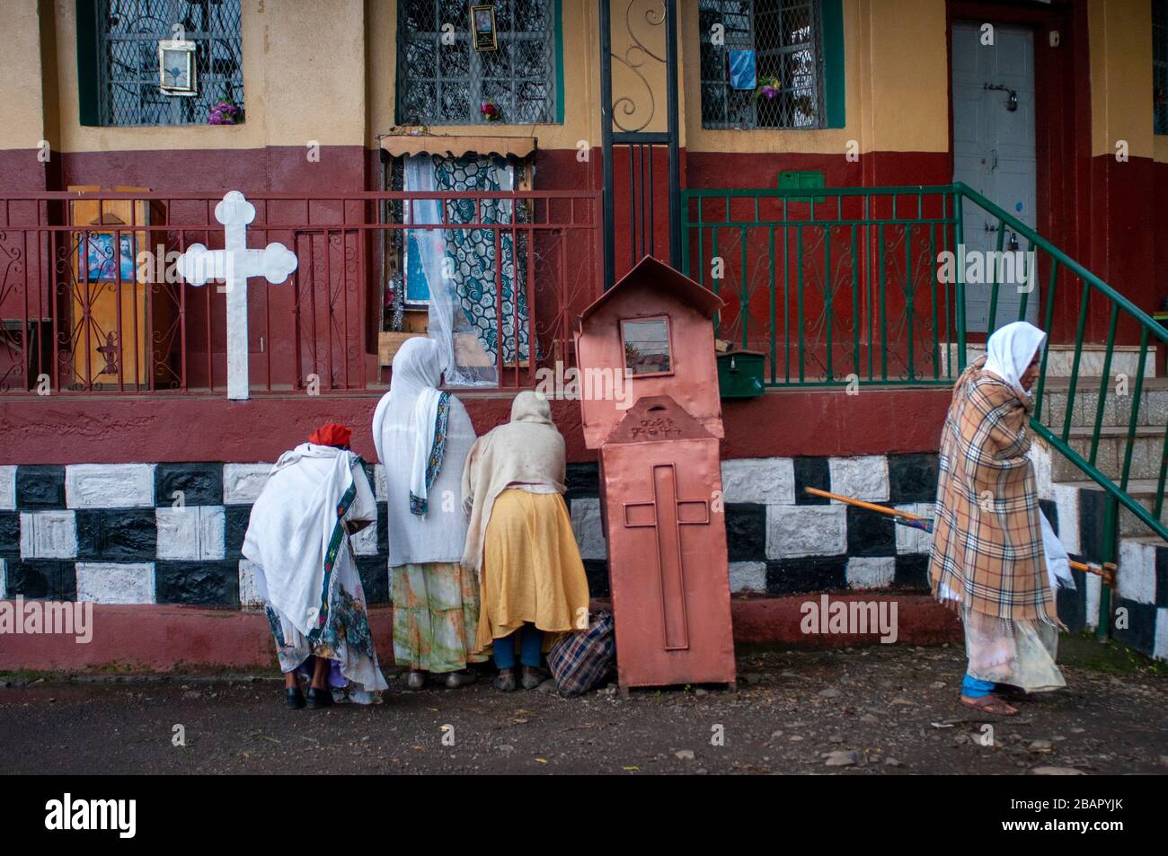 Old church in Gondar, Ethiopia. In the central square of the city of Gondar stands out the proximity of a new cybercafe 'Facebook' next to the old chu Stock Photo