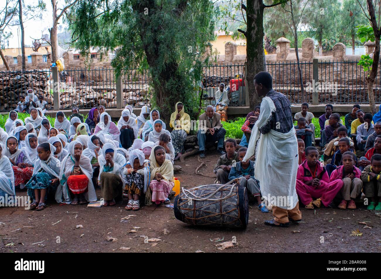 St Mary of Zion church, Aksum, Ethiopia. Several separated boys and girls are doing catechesis inside the church of St Mary of Zion in Axum. The Ark o Stock Photo