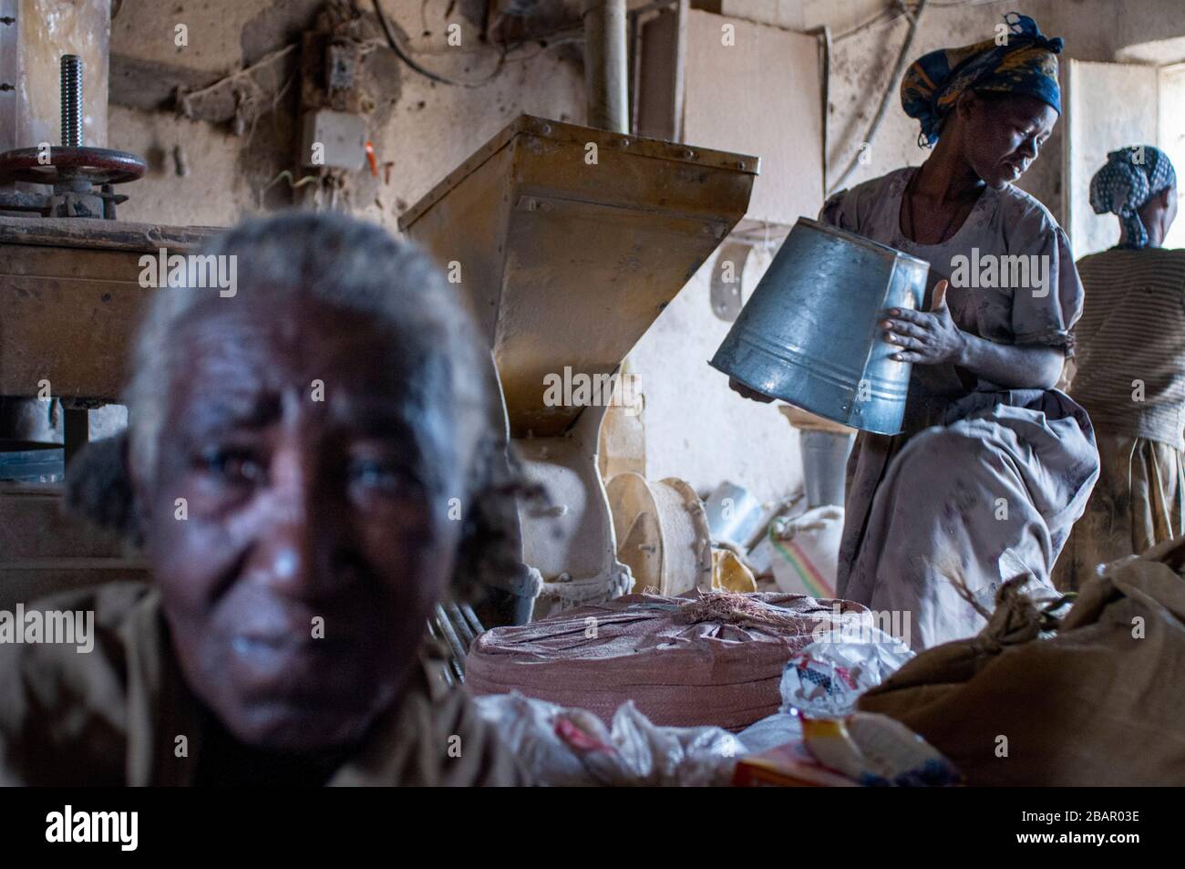 Adwa village or Adua Tigray Region, Ethiopia. Some women sift through cereal grains in the village of Atwa. Teff, the cereal from Ethiopia. The teff i Stock Photo