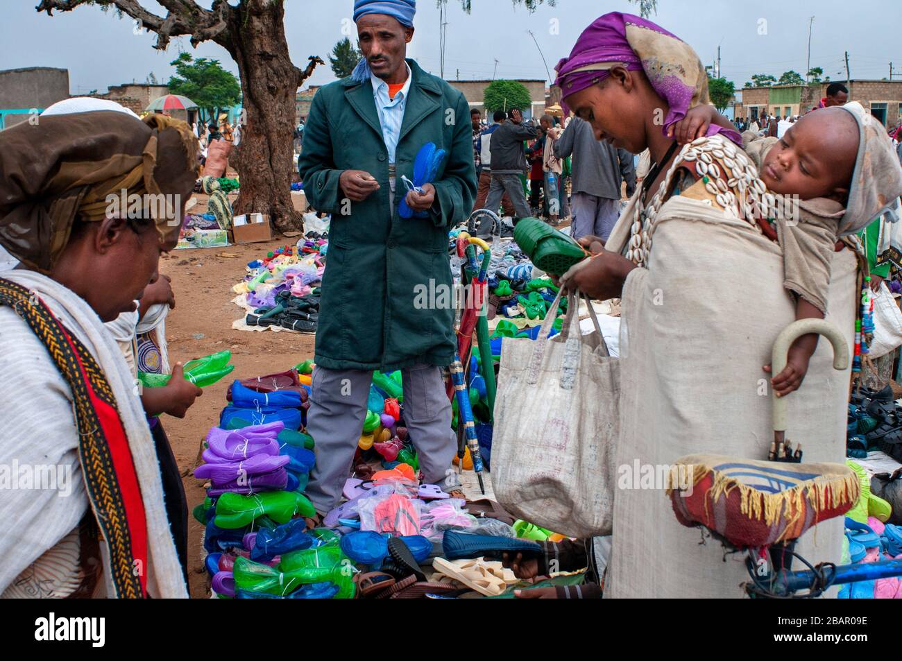 Vendors sell produce at the public market in the town of Hawzen, Tigray Region, Ethiopia on a sunny day. Stock Photo