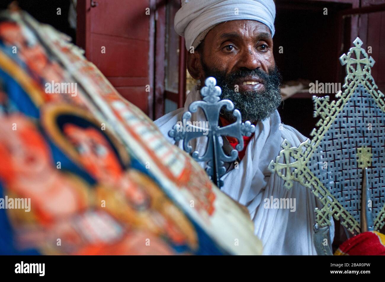 Portrait of an ethiopian orthodox priest holding a cross in nakuto lab
