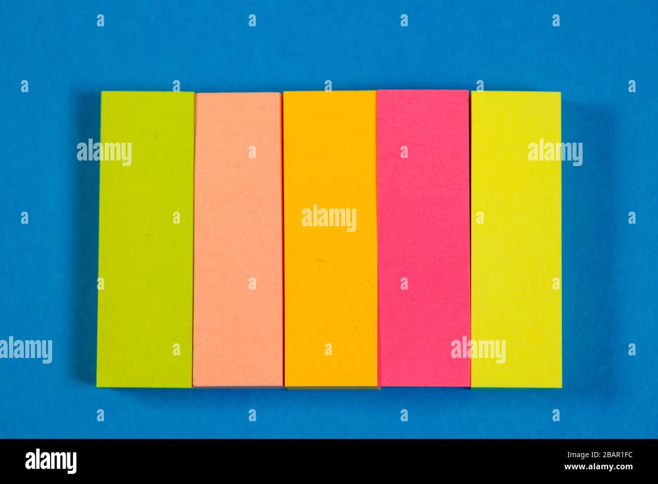 color stickers for notes on a colored background Stock Photo - Alamy
