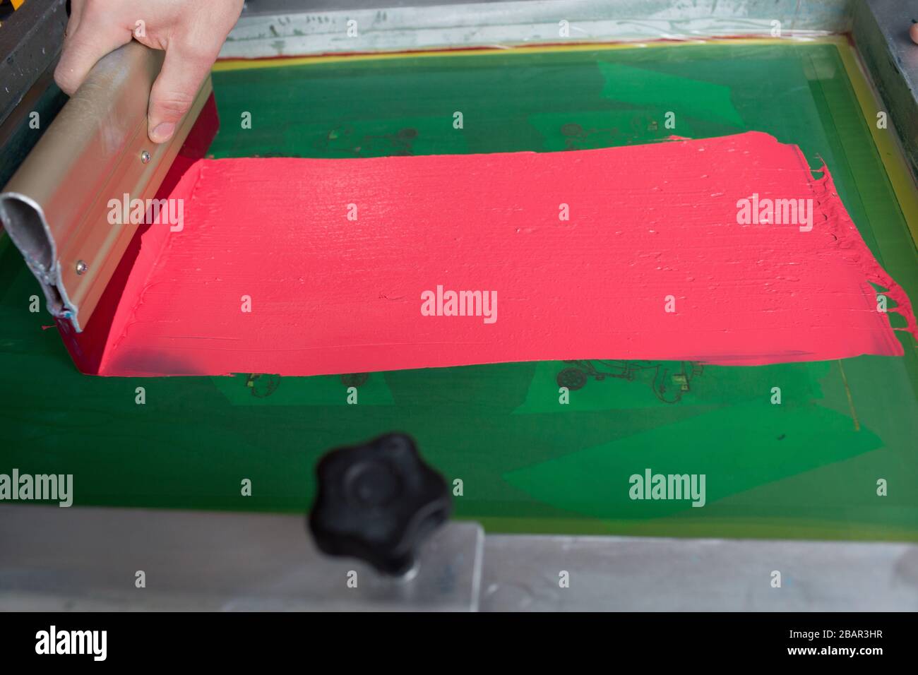 Silk screen printing. Serigraphy. Color paints and fabric. Plastisol